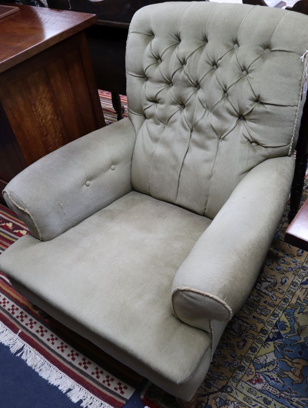 A late Victorian walnut buttoned library chair, W.84cm, D.90cm, H.90cm